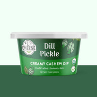 Container of Nuts for Cheese Dill Pickle Creamy Cashew Dip on a green background