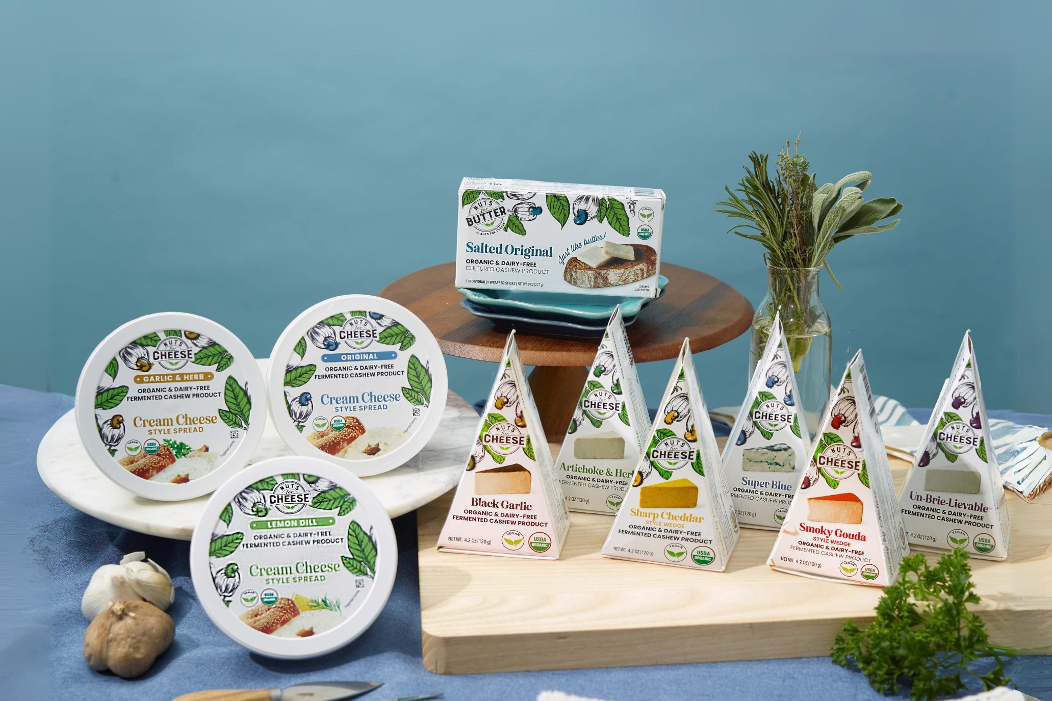 vegan cashew nuts for cheese bundle presentation with three cream cheeses, 6 cheese wedges and salted butter