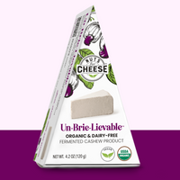 Nuts for Cheese Un-Brie-Lievable organic and dairy-free cheese wedge box with purple two toned background