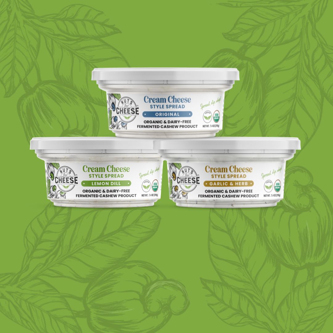 Nuts For Cream Cheese™ collection of plant-based cream cheese products on a green cashew flower background
