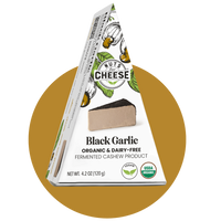 Nuts For Cheese™ Organic & dairy-free fermented Black Garlic cheese wedge package on a gold circle background