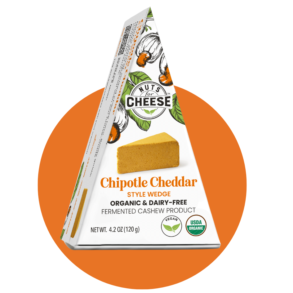 Nuts For Cheese™ Organic & dairy-free fermented Chipotle Cheddar cheese wedge package on a orange circle background