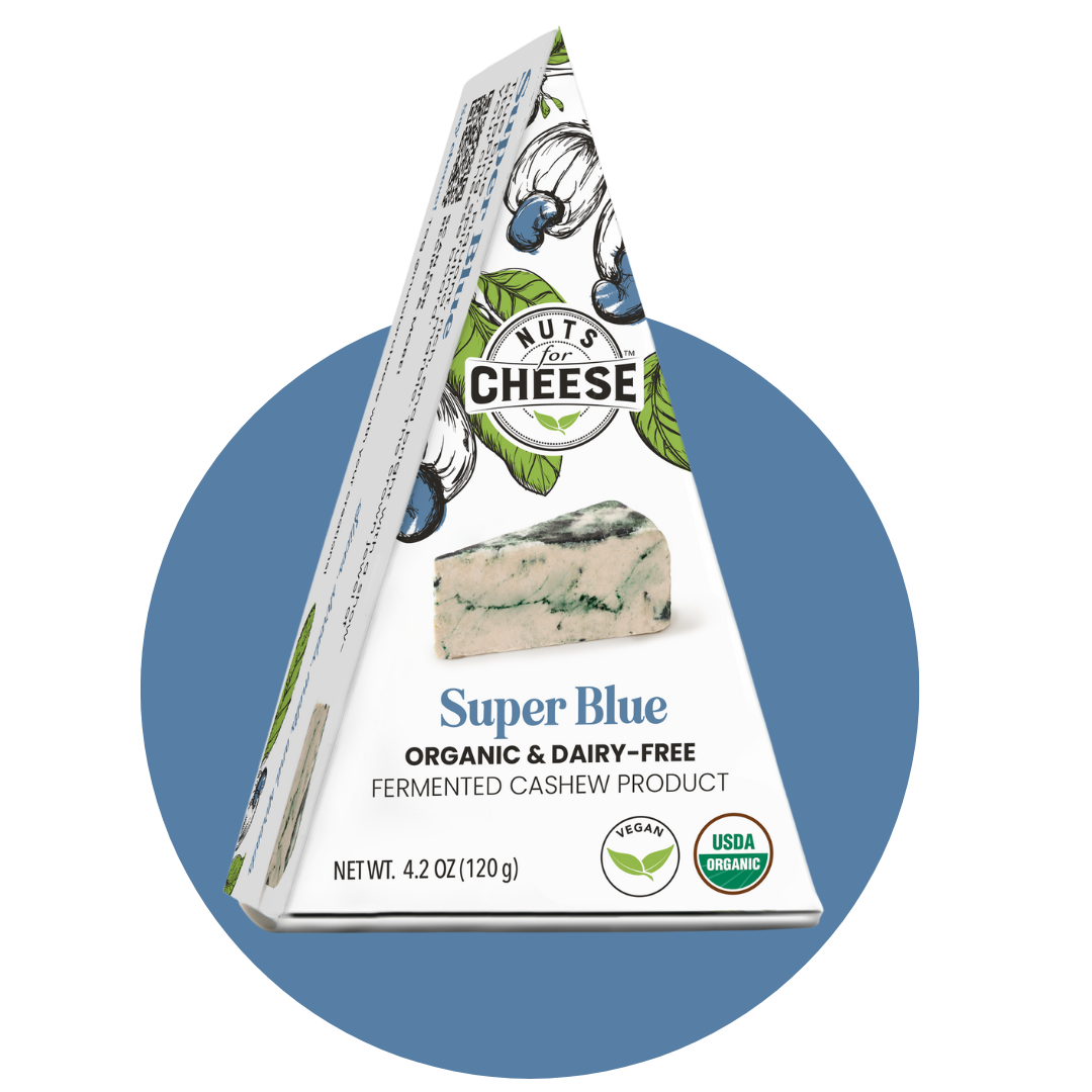 Nuts For Cheese™ Organic & dairy-free fermented Super Blue cheese wedge package on a blue circle background